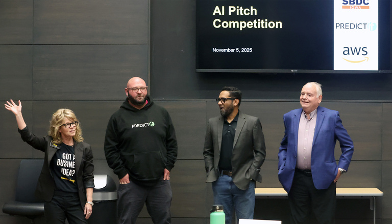 Dana Rupe and the judges for the AI Pitch Competition