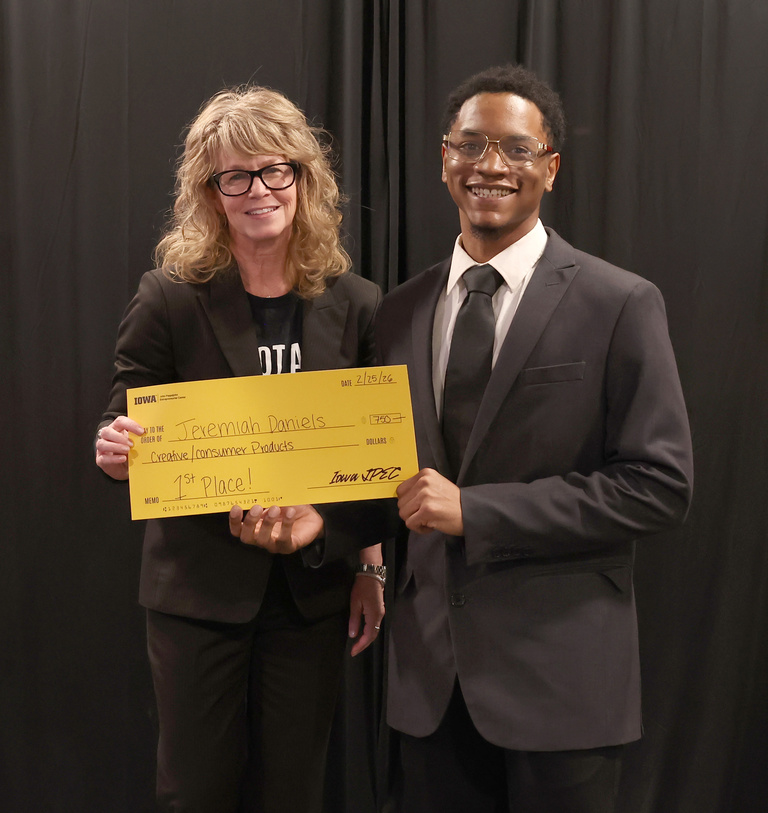 1st Place Creative/Consumer Products: judge Dana Rupe with Jeremiah Daniels. 