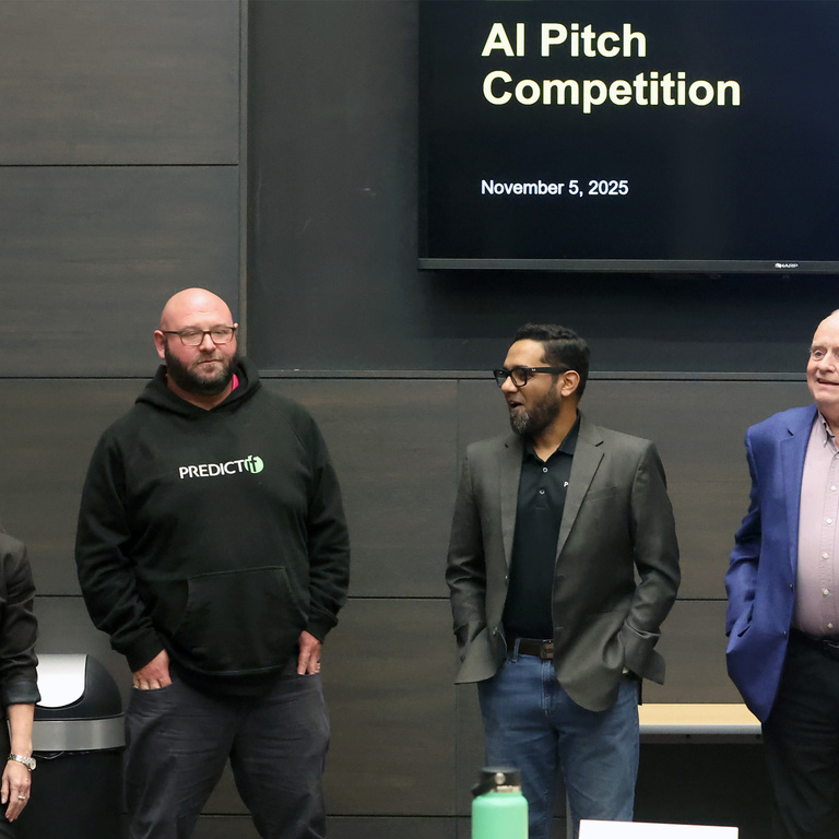 Dana Rupe and the judges for the AI Pitch Competition