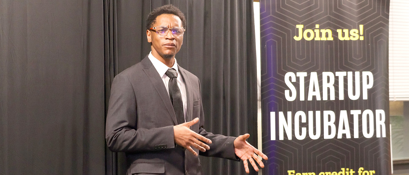 Photo of Jeremiah Daniels pitching at IdeaStorm
