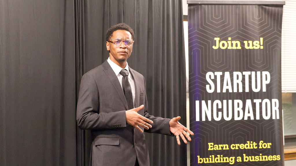 Photo of Jeremiah Daniels pitching at IdeaStorm